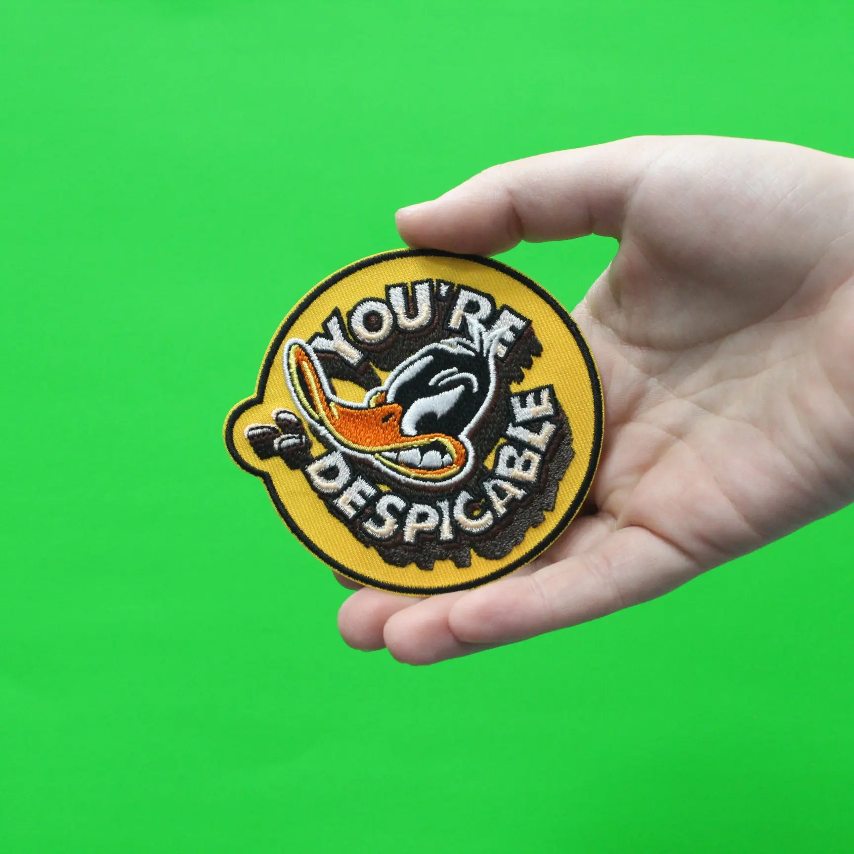 Official Daffy Duck You're Despicable Round Embroidered Iron On Patch - Image 2