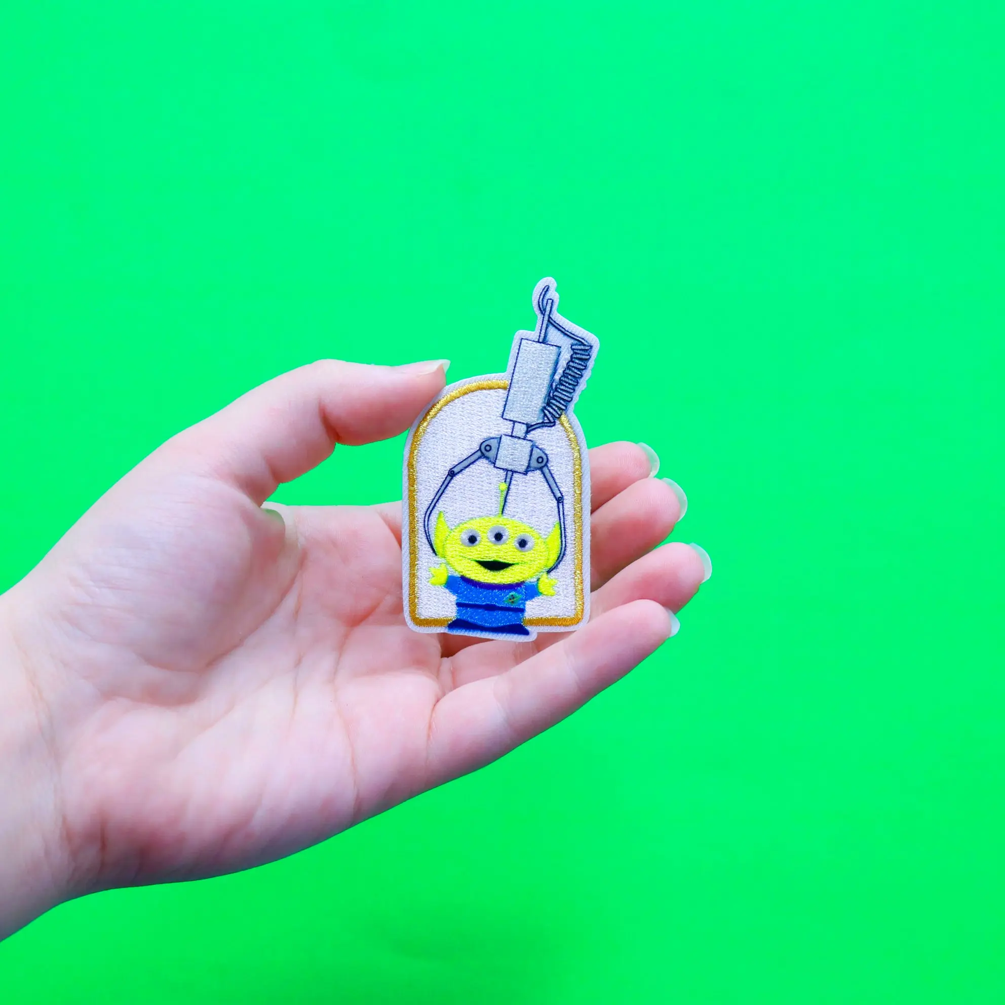 Official Toy Story: Alien And The Claw Embroidered Iron On Applique Patch - Image 3