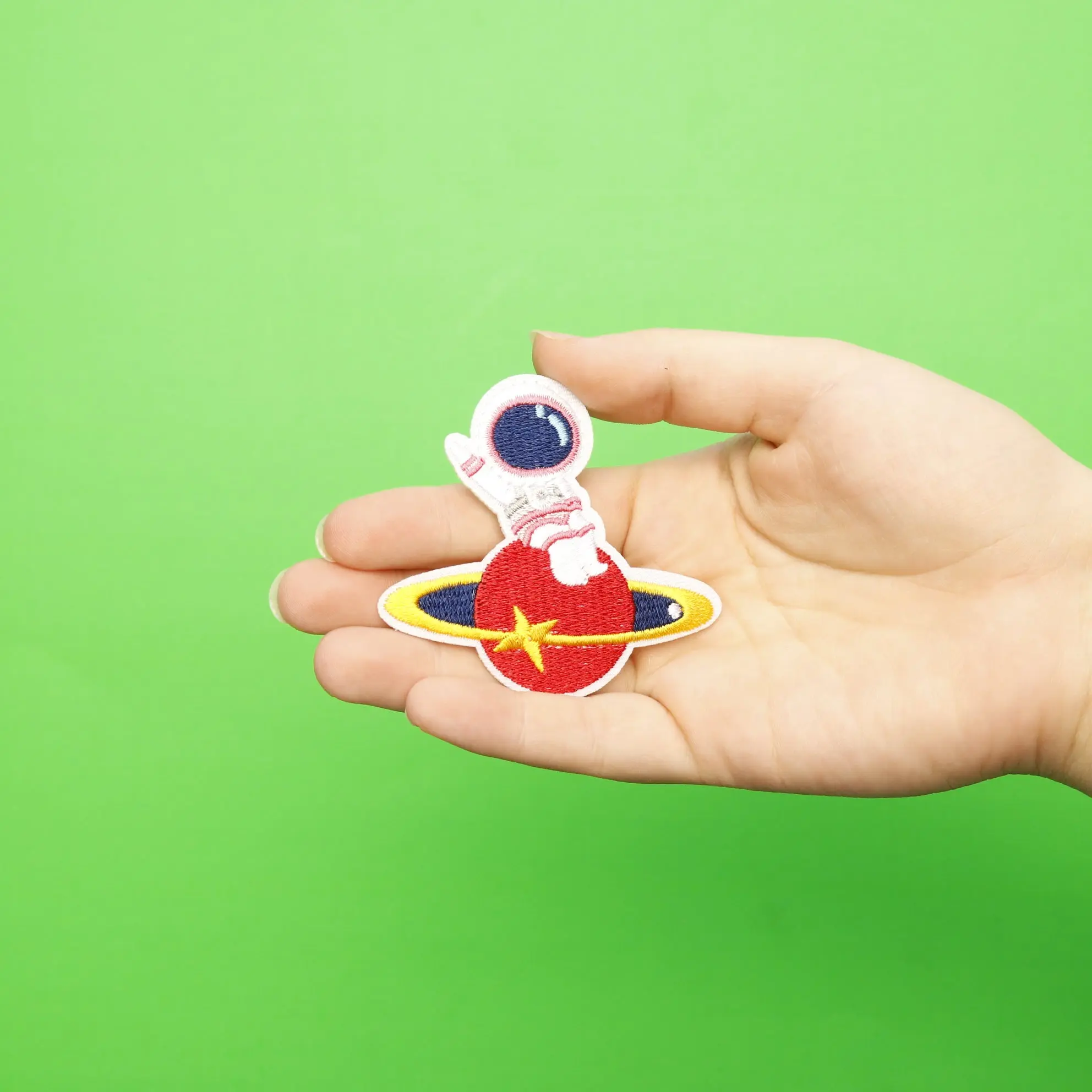 Small Pink Astronaut Sitting On A Red Planet Embroidered Iron On Patch - Image 2
