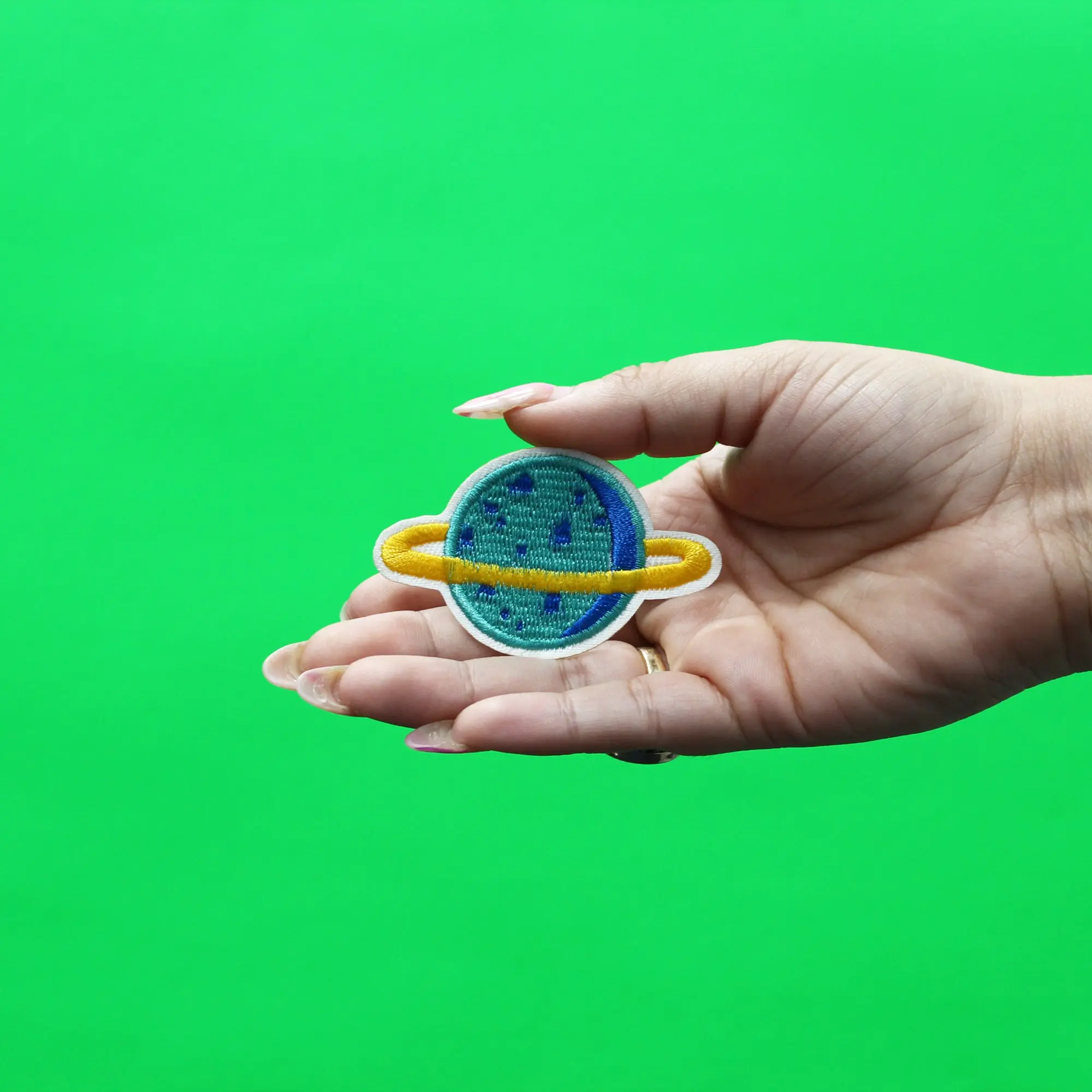 Small Teal Planet With Gold Ring Embroidered Iron On Patch - Image 2